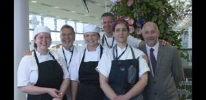 Group photo – First row, left to right: Emma, Holly, Emily, Simon Genduso, Professional Cookery Lecturer at Activate Learning. Second row, left to right: Raymond Blanc OBE, and unknown member of staff.