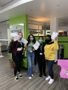 Four Reading students celebrating A Level results