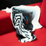 Esports kit draped over a sofa