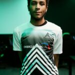 Esports student models the Reading College Esports team kit