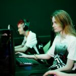 Mina and Seth model the kits while playing an Esports game