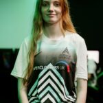 Female student models the Reading College Esports team kit