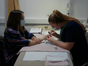 Beauty therapy student gives NHS keyworker a manicure