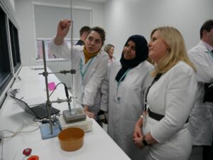 Students demonstrate a science experiment to Cheri Ashby, Deputy Chief Executive at Activate Learning 