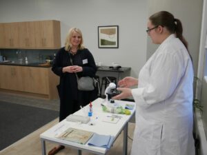 A student talks about their science practical to Sarah Atkinson, Thames Valley Berkshire LEP. 