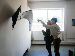 Visitors looking at angel wings