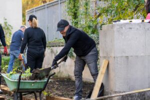 The volunteers turn the individual beds into one bed