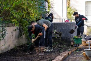 The volunteers turn the individual beds into one bed