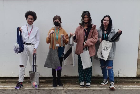 Leo, Lara, Neha and Jess model the bags that they have made.