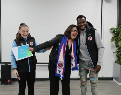 Lily Woodham and Baba Rahman stand with Halley Male who received an attendance certificate