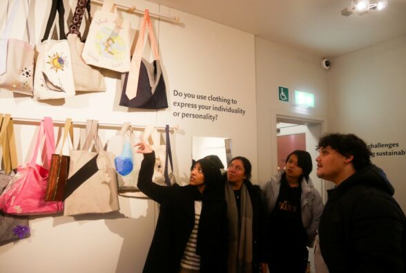 Work Preparation Horizons students from Reading College looking at the exhibition and discussing their bags with the four Education Studies students from the University of Reading, who are doing a placement at MERL.