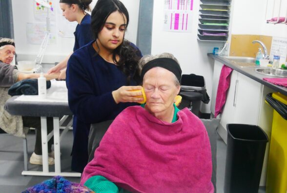 Sania Iqbal, a Level 1 Hair and Beauty student gives Gilly Smith, a resident at Lakeside Care Home, a facial. 
