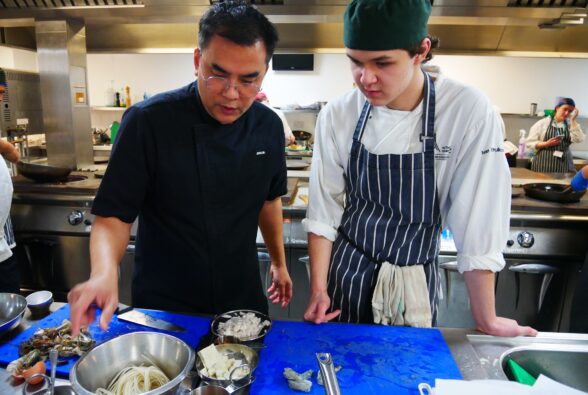 Chef Jay talks to Ivan Khrulkov, Professional Culinary Arts student, about the dish he is preparing.