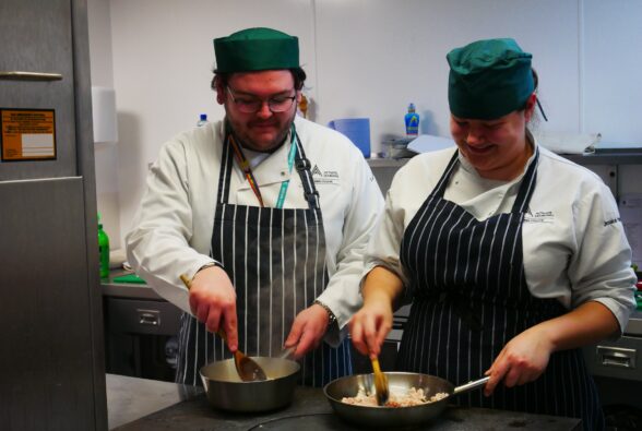 Professional Culinary Arts students Lucas and Jessica preparing Thai cuisine