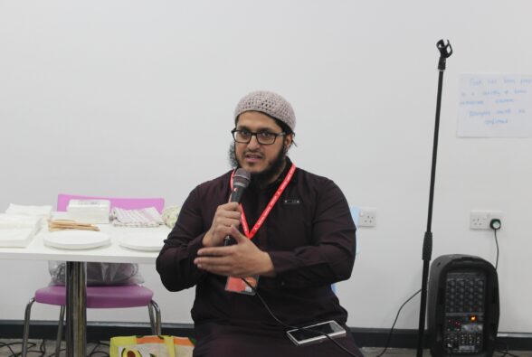 Imam Yahya from Aisha Masjid and Islamic Centre speaking at the Community Iftar Meal at Reading College