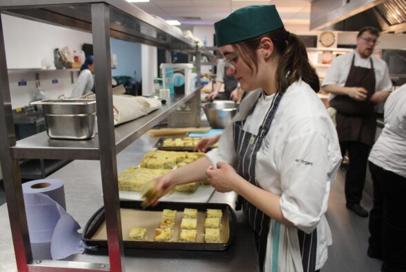 Jamie Argent, a Professional Culinary Arts student at Reading College preparing Tortilla Espanola