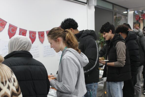 Students and staff helping themselves to the food available at the Community Iftar Meal at Reading College