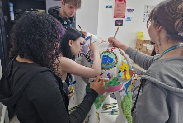 Students working on the elephant sculpture