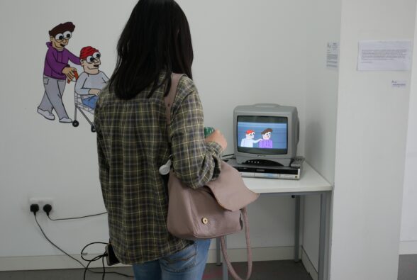 A member of the public looks at an animation at the exhibition.