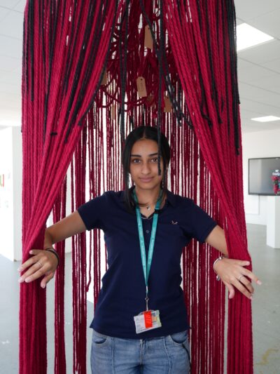 Siman Bansel opening her adult mind part of her installation.